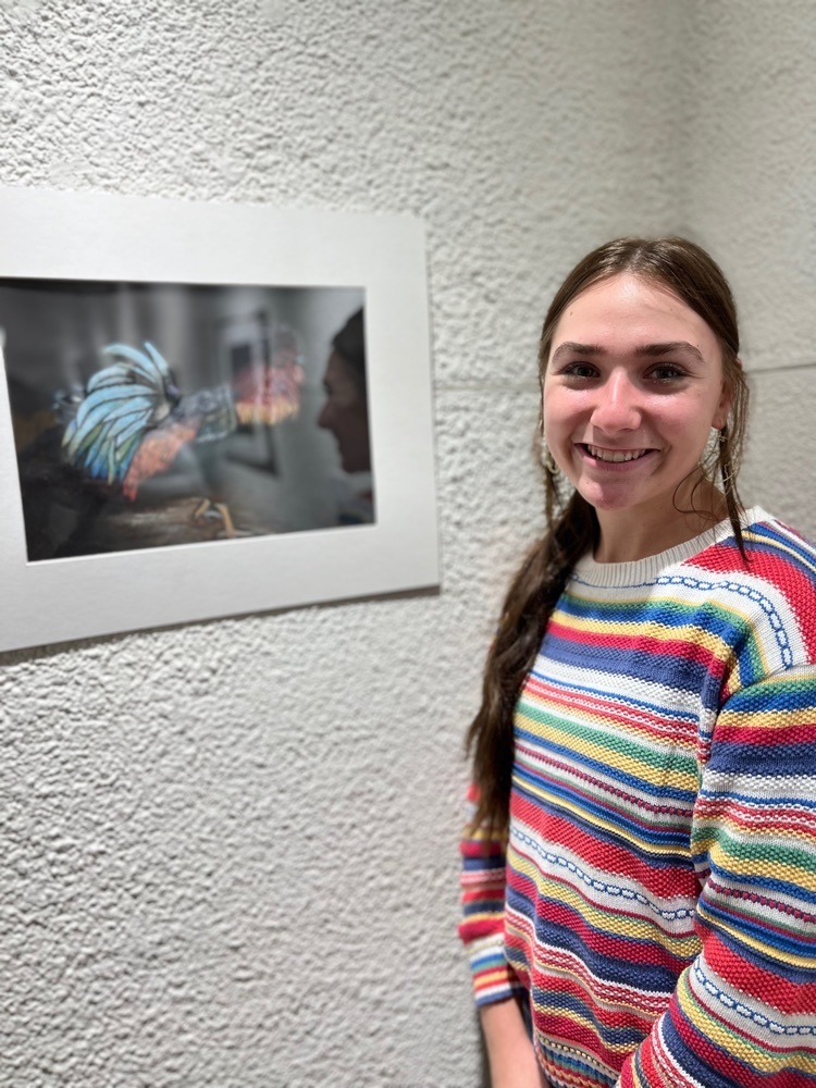 Mikayla Dryer with her pastel drawing at Quincy Art Center 
