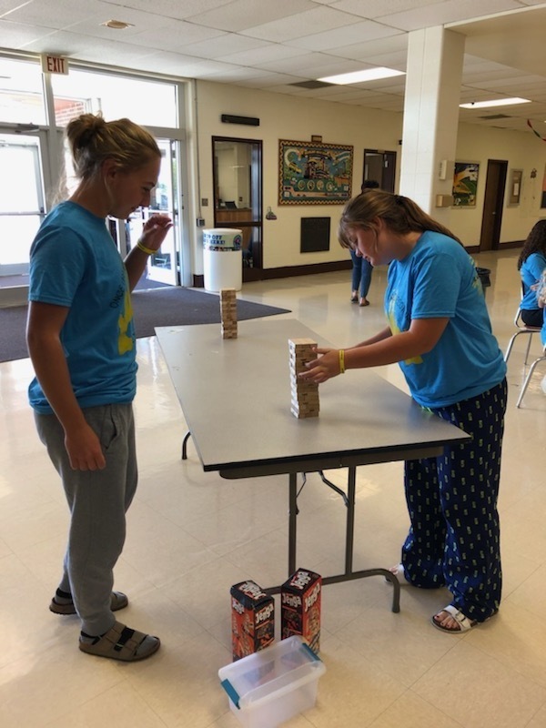 Two HHS students playing Jenga as a Suicide Awareness activity at lunch.